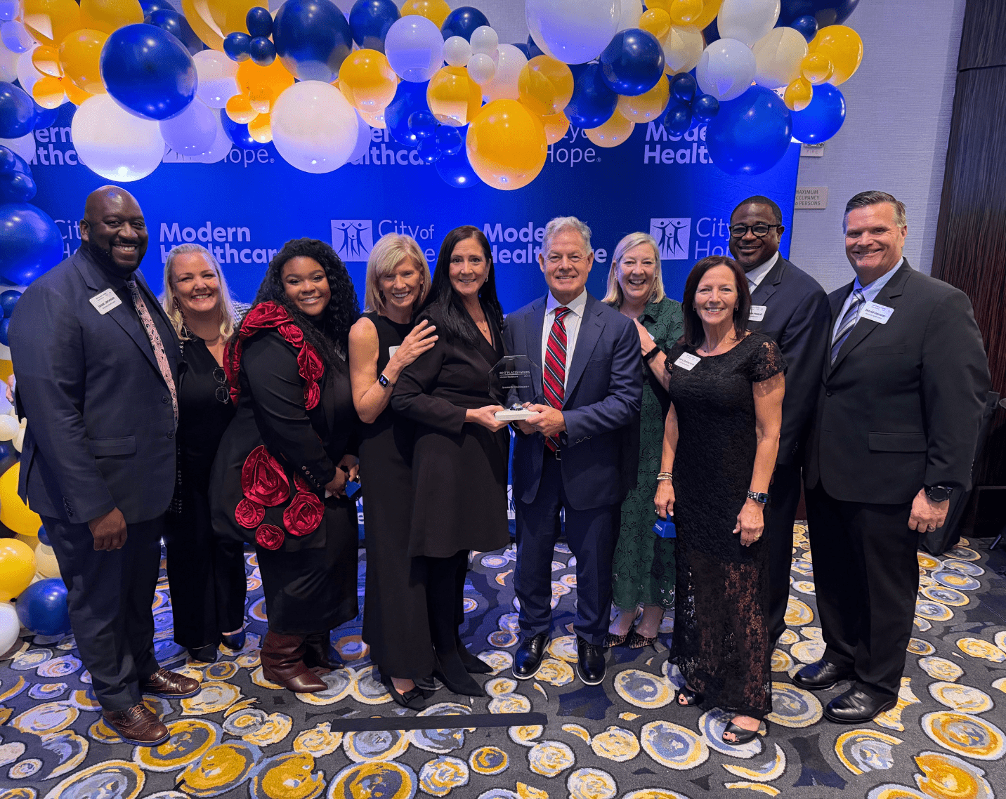 Aramark Healthcare+ leaders, including President and CEO Paul "PJ" Johnson (center), celebrate at Modern Healthcare's Best Places to Work in Healthcare gala following the organization's recognition as the #1 Overall Supplier Organization and, for the third consecutive year, the top-ranked Large Supplier.